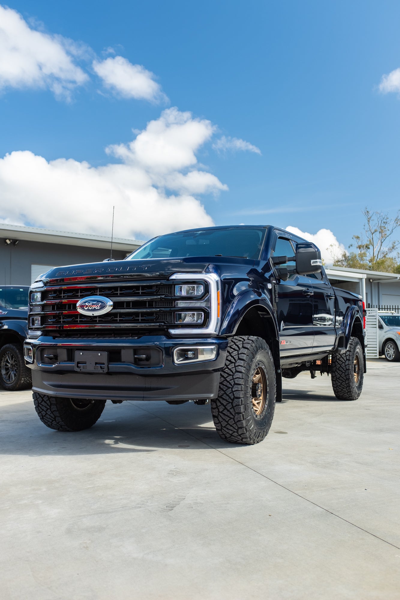 NEW 2023 FORD F350 LARIAT 'SHOP CUSTOM' - ANTIMATTER BLUE (STOCK # 5042)